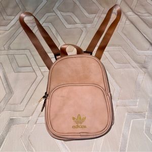EUC Adidas mini backpack in pastel light pink with gold hardware and embroidery